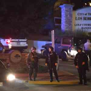 Law enforcement officers standing in the street of the active shooting location of Borderline Bar & Grille in California on the night of 11/7/2018