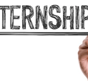 Some one writing internship on a white board for UASC's sales support internship