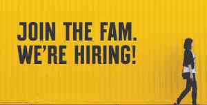 a yellow image with black text stating "join the fam. we're hiring!" with a woman walking beside the image.