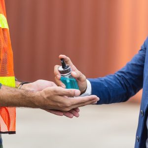 hand sanitizing on construction site